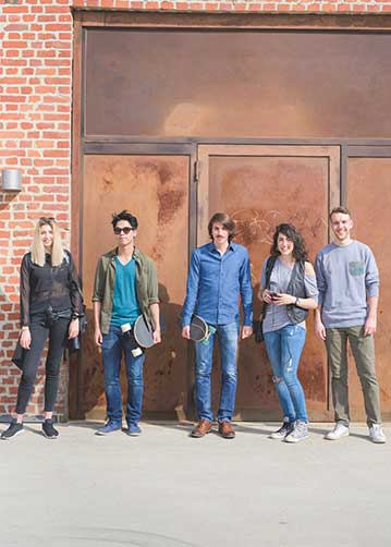 THRU Project provides support and resources for foster looking for after foster care help young multi-ethnic men and women stand in front of brick wall